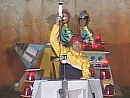 A contestant in a Show Down cart hold his laser gun aloft in celebration
