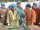 Saburo, Takeshi and five guards look at a model of the games they're having to play themselves