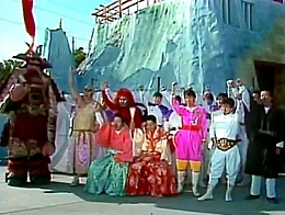 The cast of Takeshi's Castle with fists pumping the air